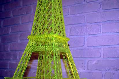 Green fluorescent plexiglass acrylic scroll saw model of the Eiffel Tower