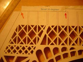marks to guide the cutting of pieces in the scroll saw wooden model of the Eiffel Tower