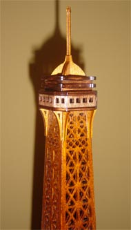 upper part of the scroll saw fretwork wooden model of the Eiffel Tower