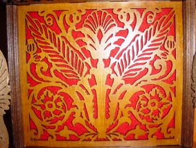 fretwork with red felt in the base of the egg clock