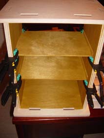 interior of the wooden scroll saw security box during mounting