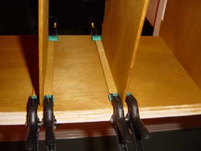 security box shelves drying in position held with clamps